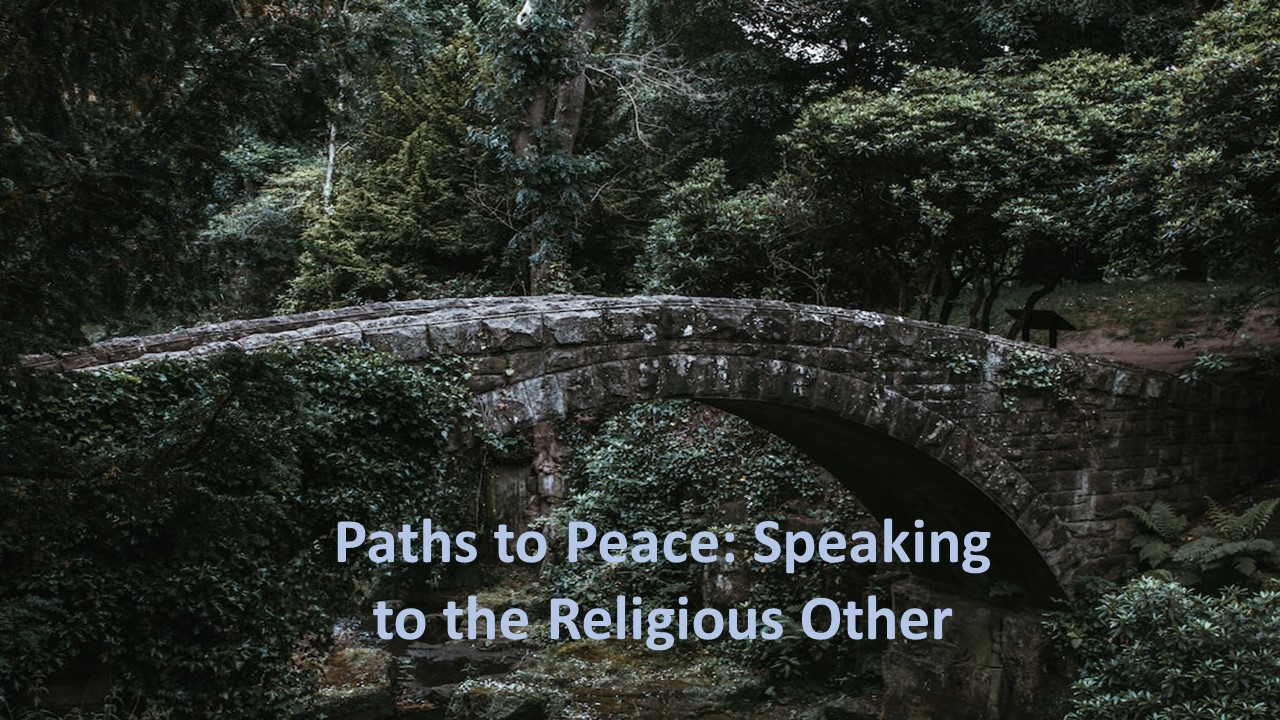 A stone bridge with trees around itDescription automatically generated